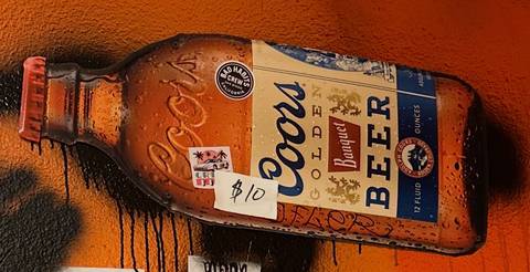 Coors Banquet bottle-shaped metal sign