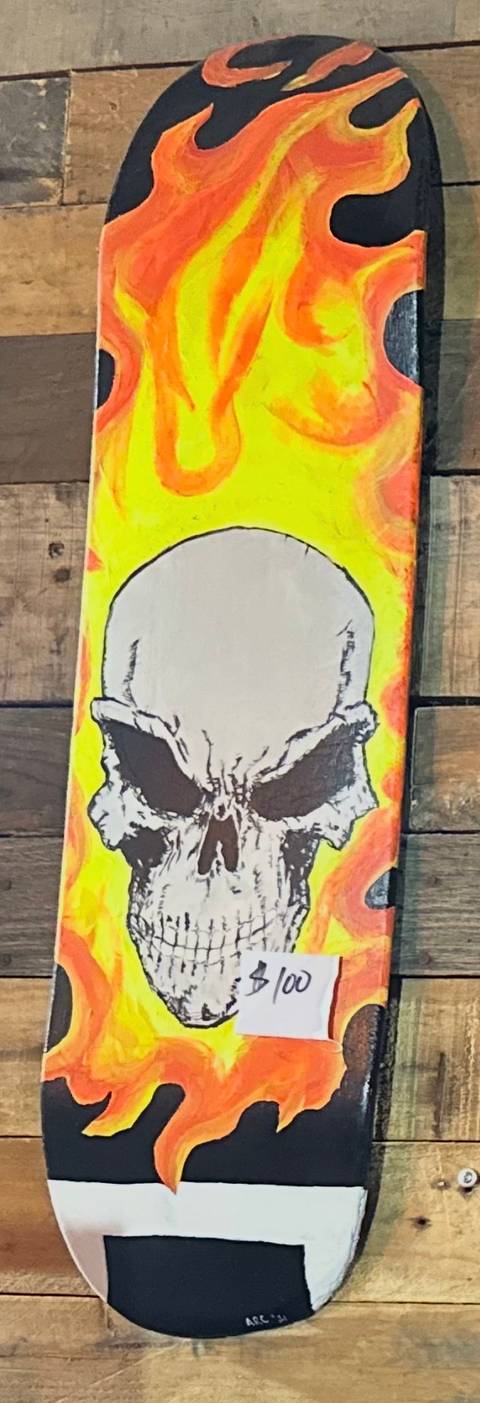 Hand-painted flaming skull skate deck