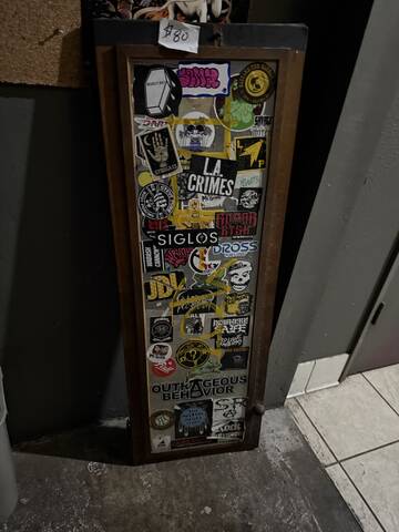 Sticker-bombed glass cabinet door
