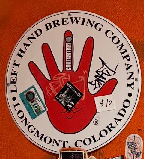 Left Hand Brewing round metal sign