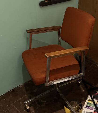 Orange rolling office chair